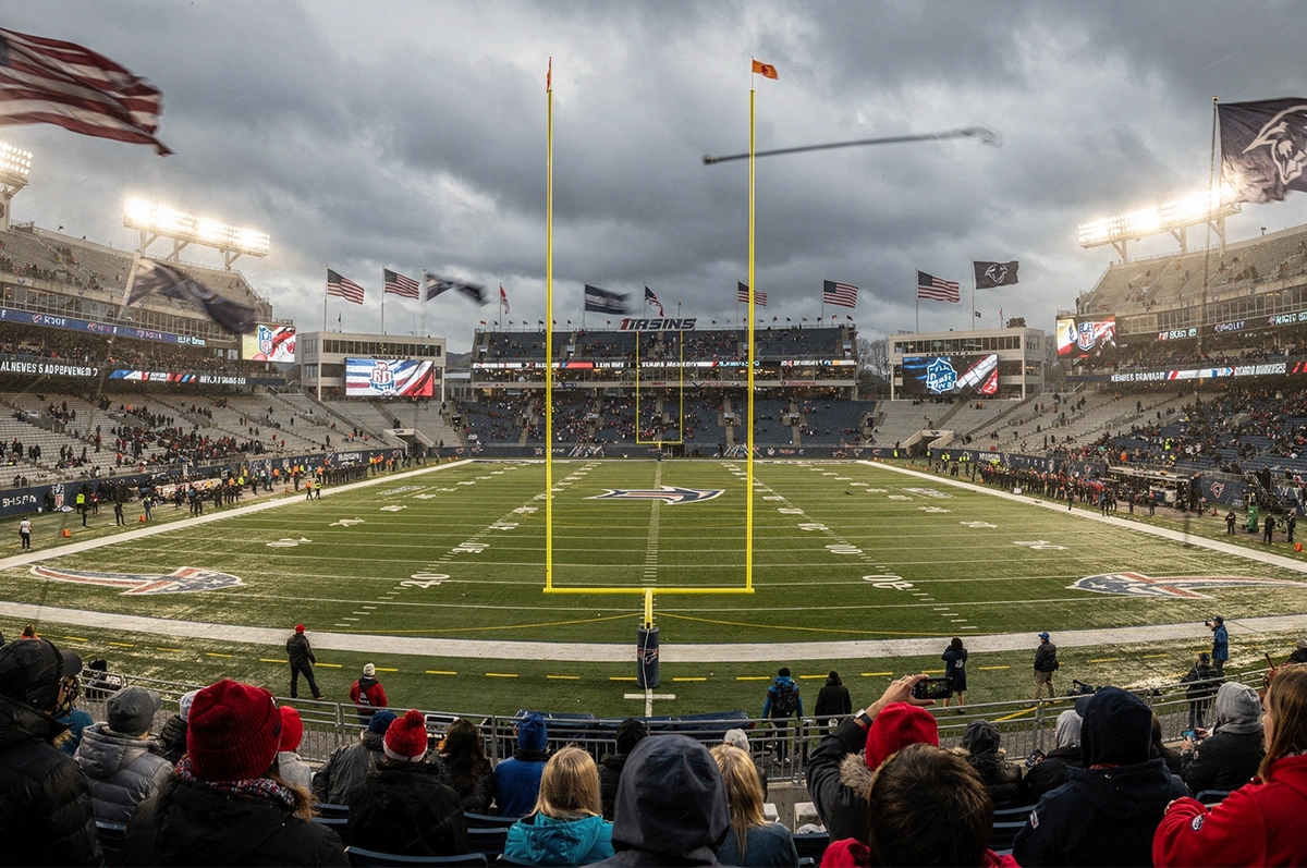 Football stadium showing windy weather conditions affecting outdoor game